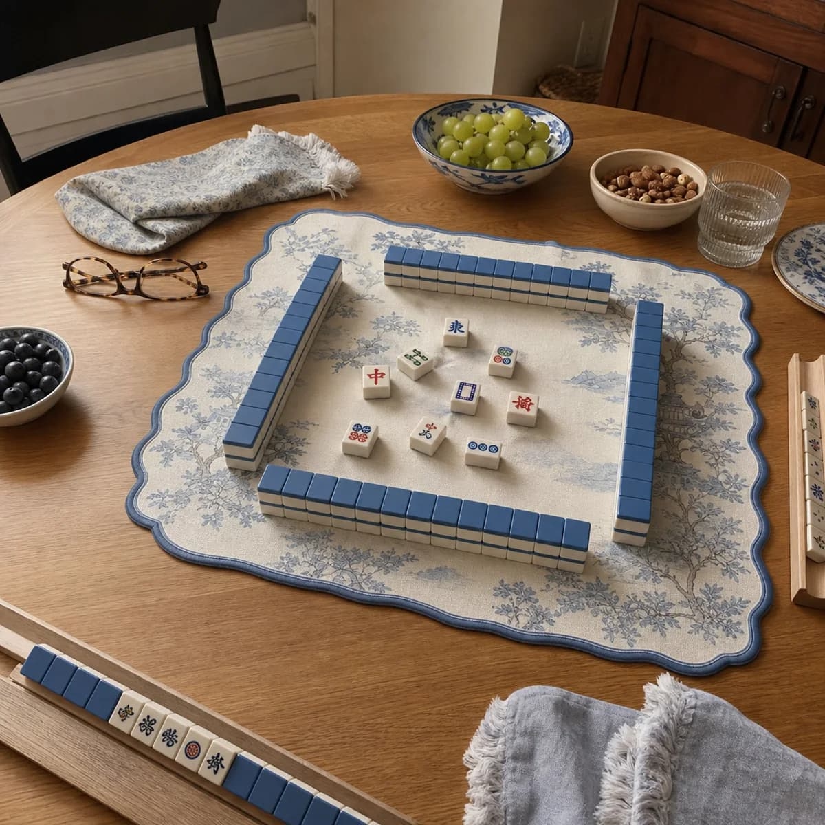 Blue Garden Mahjong mat on a casual breakfast table